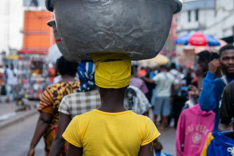 A busy Ghanaian market crowd where many languages are spoken